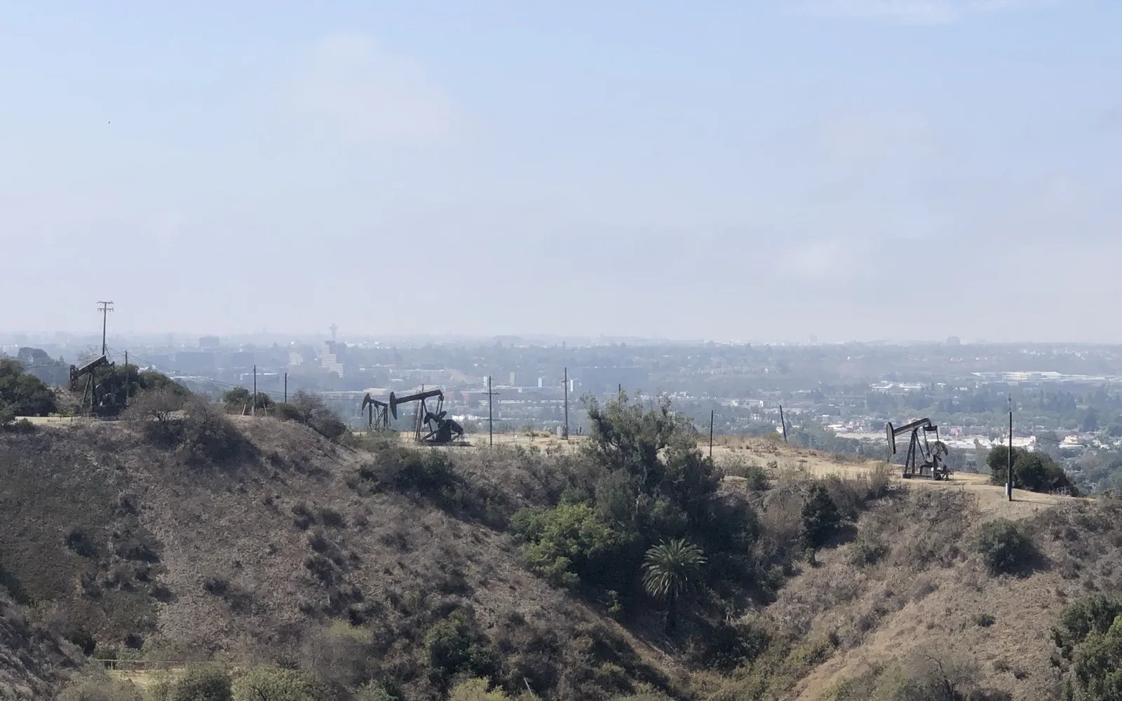 Three oil pumpjacks (nodding donkeys) at the Inglewood Oil Field